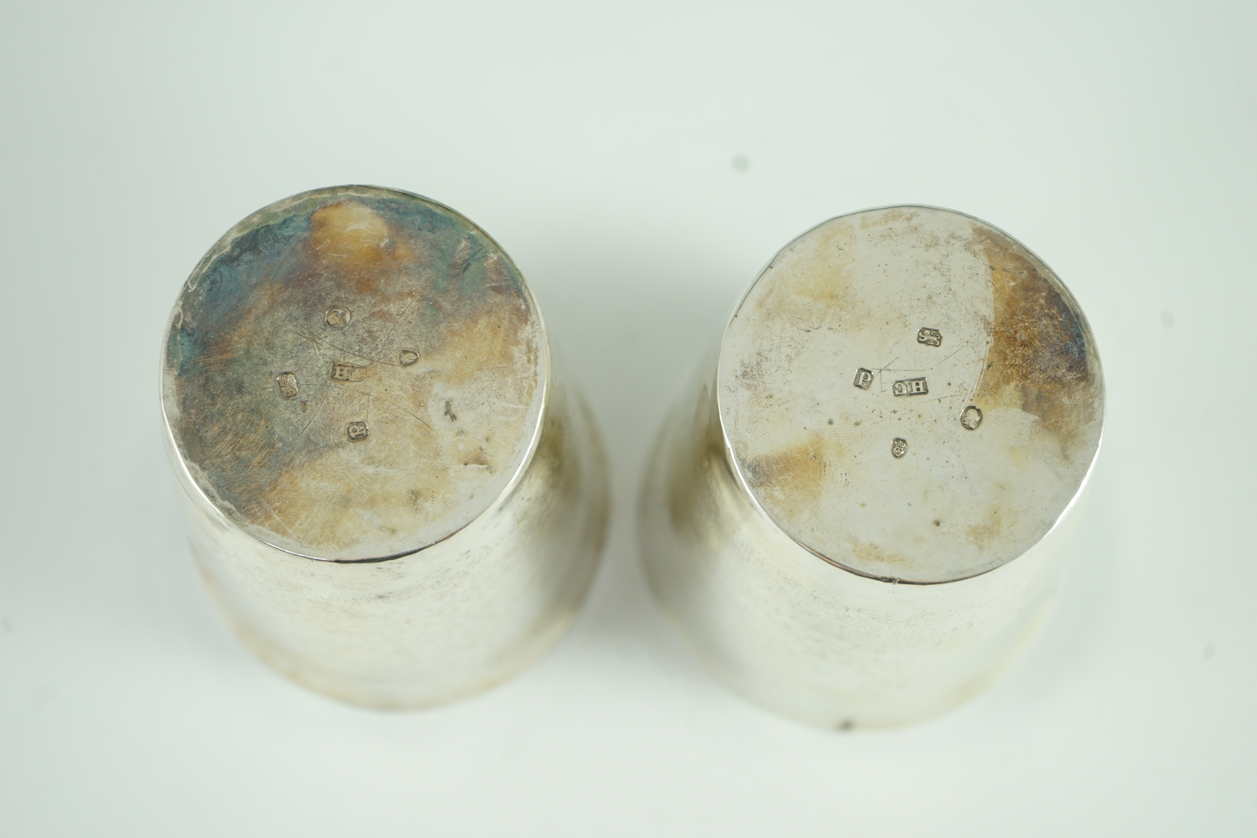 A pair of George III part textured silver beakers, by Henry Chawner